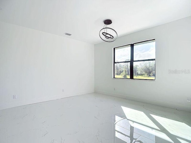 16760 Acapulco Rd, Punta Gorda, FL 33955 - unfurnished room featuring light marble finish floors