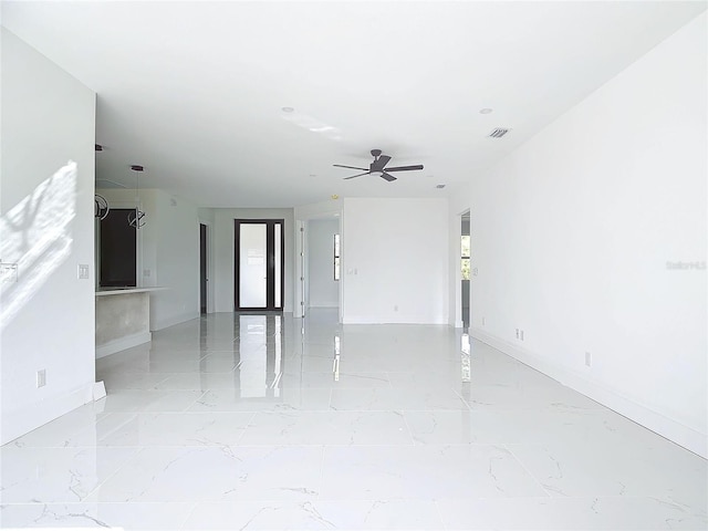 16760 Acapulco Rd, Punta Gorda, FL 33955 - empty room with light marble finish floors and ceiling fan