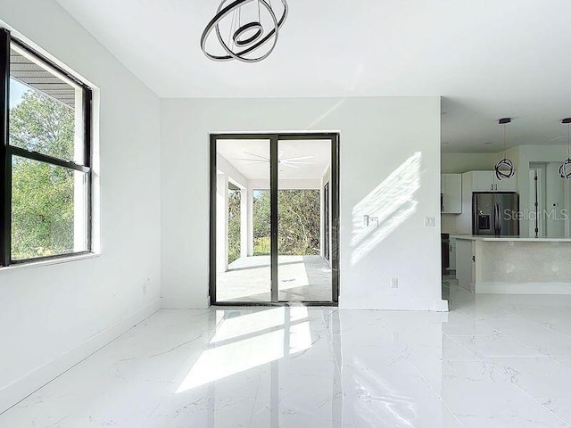 16760 Acapulco Rd, Punta Gorda, FL 33955 - empty room with light marble finish floors