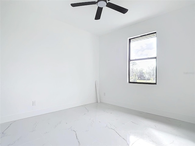 16760 Acapulco Rd, Punta Gorda, FL 33955 - unfurnished room with light marble finish flooring and a ceiling fan