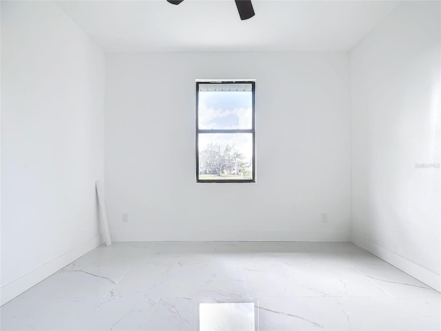 16760 Acapulco Rd, Punta Gorda, FL 33955 - empty room with a ceiling fan and light marble finish floors
