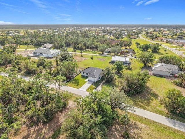 16760 Acapulco Rd, Punta Gorda, FL 33955 - aerial perspective of suburban area with a tree filled landscape