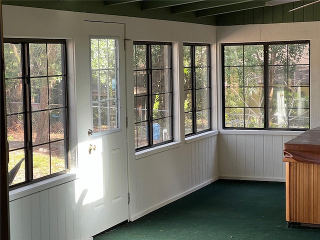 unfurnished sunroom featuring a wealth of natural light