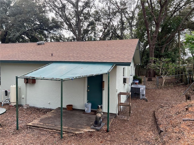 back of property with cooling unit