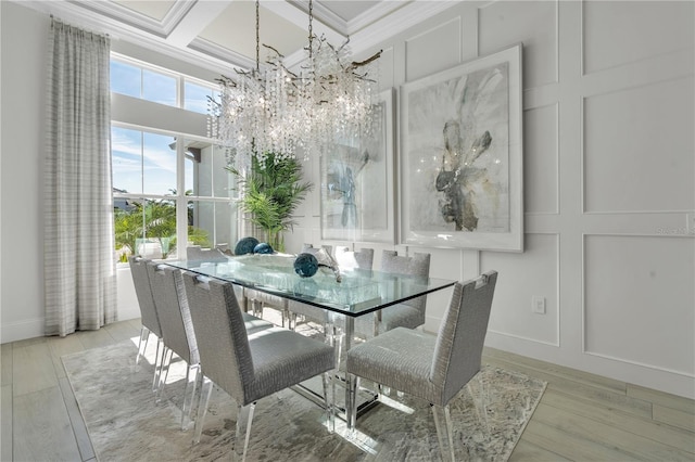 dining room featuring beam ceiling, coffered ceiling, crown molding, and an inviting chandelier