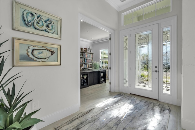 foyer featuring crown molding