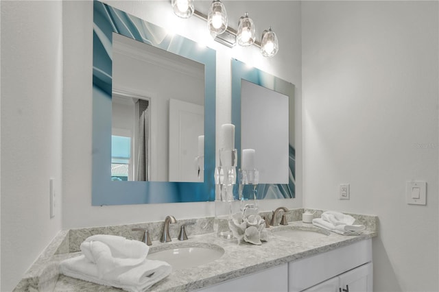 bathroom with vanity and crown molding