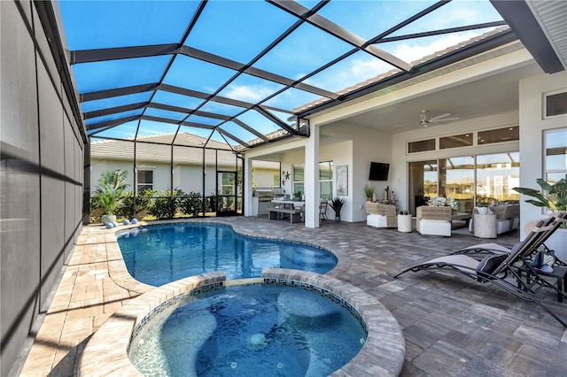 view of swimming pool with a lanai, ceiling fan, a patio, and an in ground hot tub