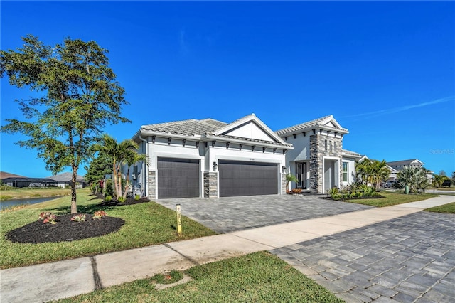 view of front of house with a front lawn and a garage