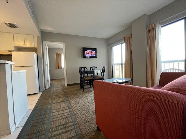 living room with light tile patterned floors