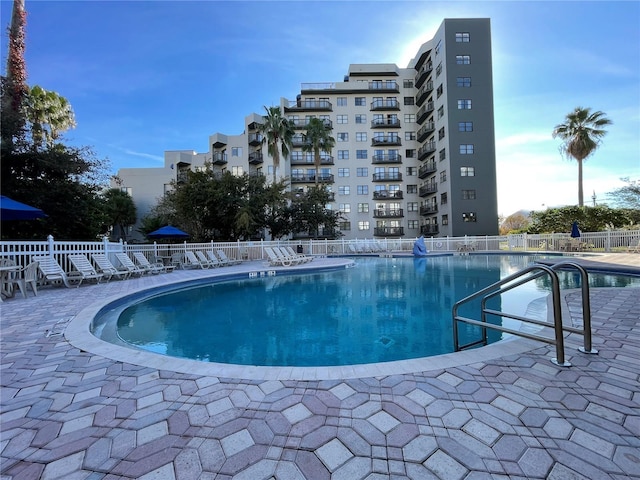 view of swimming pool featuring a patio area