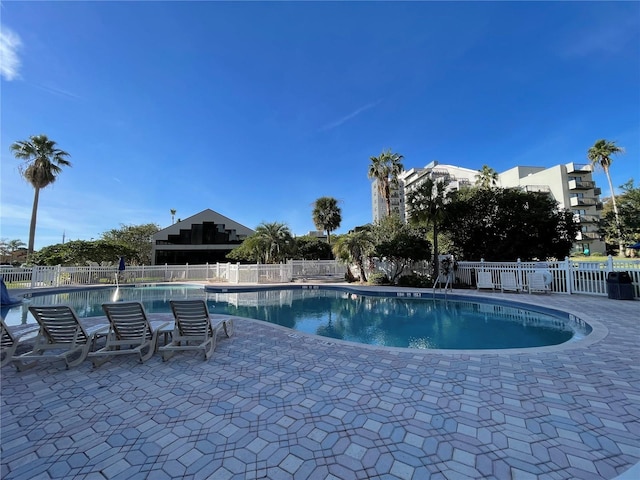 view of swimming pool featuring a patio area