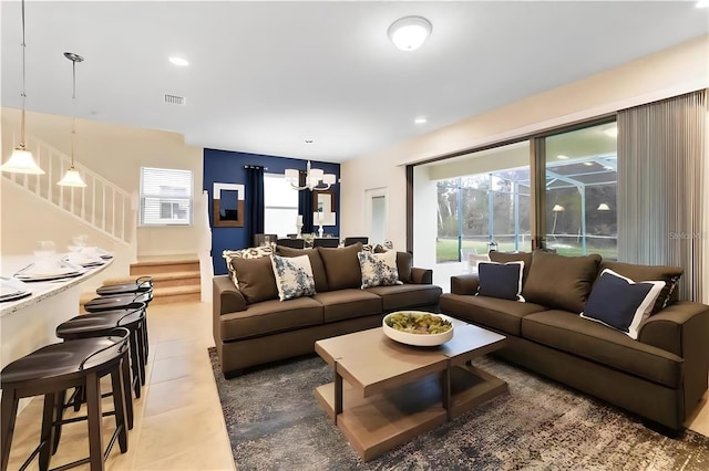 living room featuring a notable chandelier