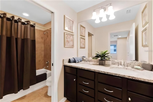 full bathroom with tile patterned flooring, vanity, toilet, and shower / bath combo with shower curtain