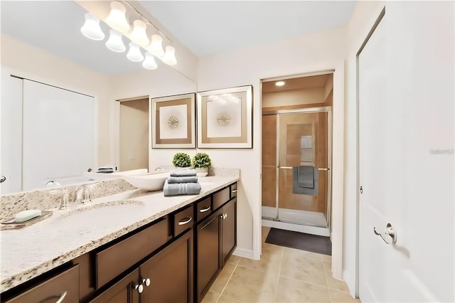 bathroom featuring tile patterned floors, vanity, and an enclosed shower