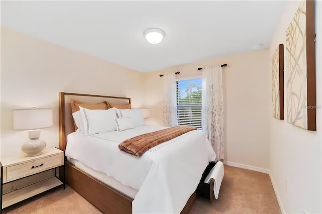 bedroom featuring light colored carpet