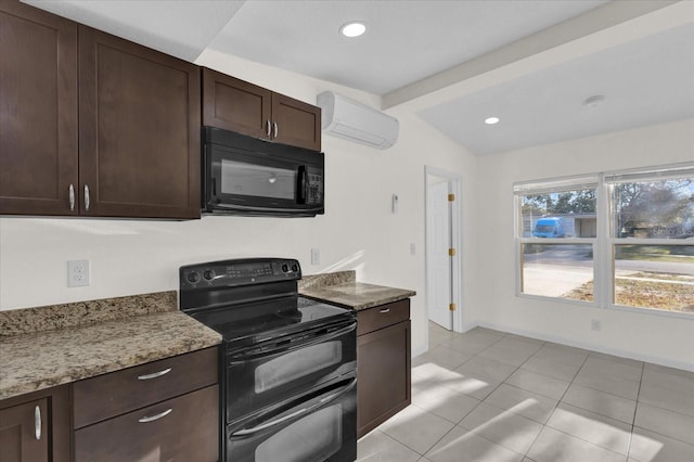 kitchen with dark brown cabinetry, light stone counters, a wall mounted air conditioner, light tile patterned floors, and black appliances