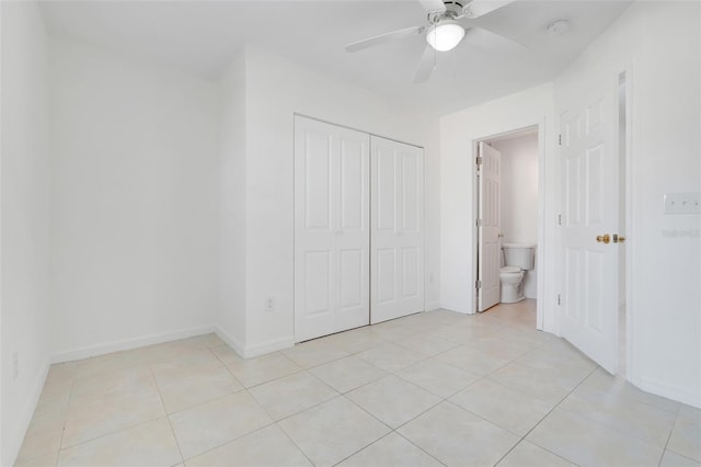 2341 Hadley St, Deltona, FL 32738 - unfurnished bedroom featuring light tile patterned floors, a closet, baseboards, and ceiling fan