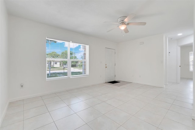 2341 Hadley St, Deltona, FL 32738 - unfurnished room with a ceiling fan, plenty of natural light, light tile patterned floors, and baseboards