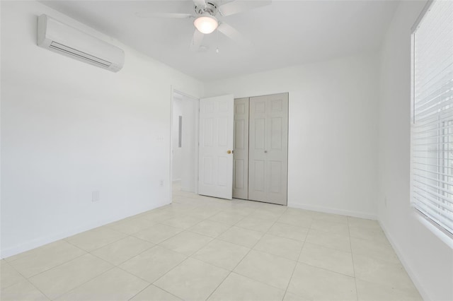 2341 Hadley St, Deltona, FL 32738 - unfurnished bedroom featuring a wall mounted air conditioner, a ceiling fan, a closet, light tile patterned floors, and baseboards