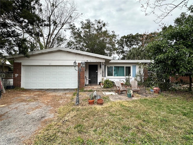 ranch-style house with a front yard and a garage