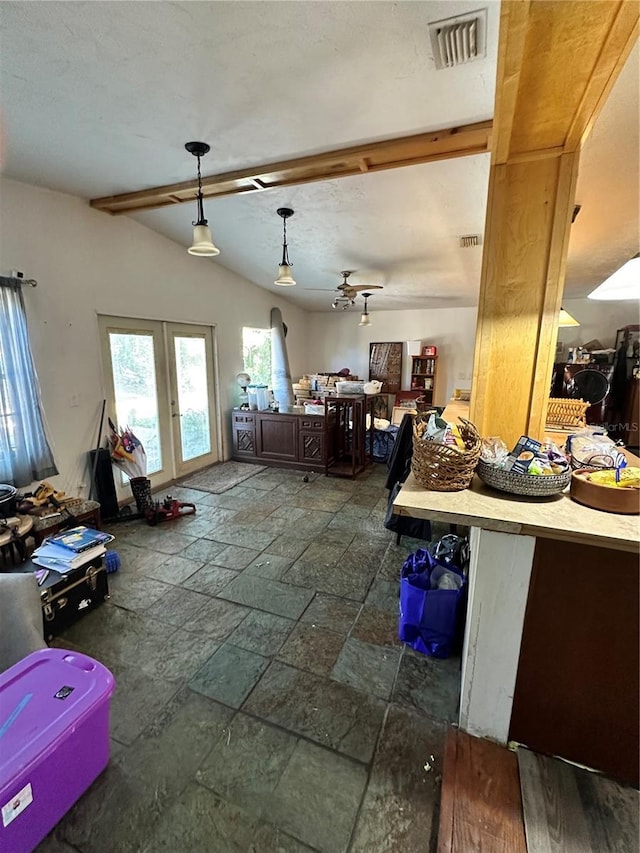 misc room featuring ceiling fan, lofted ceiling, and french doors