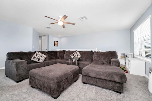 living room with ceiling fan and light colored carpet