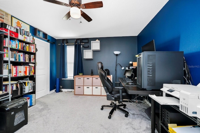 office space featuring ceiling fan and light colored carpet