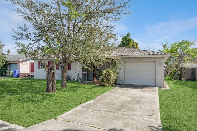 single story home with a garage, concrete driveway, a front yard, and fence