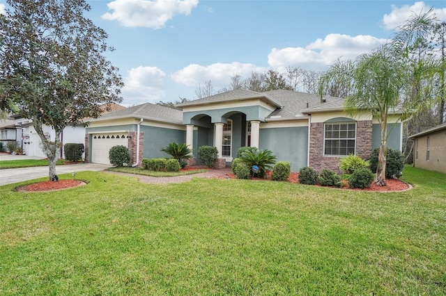 view of front of property featuring a garage and a front yard