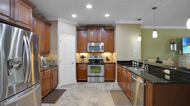 kitchen with stainless steel appliances, hanging light fixtures, ornamental molding, and sink