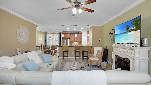 living room featuring ceiling fan and ornamental molding