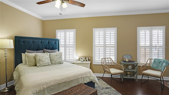 bedroom featuring multiple windows, ceiling fan, dark hardwood / wood-style flooring, and ornamental molding