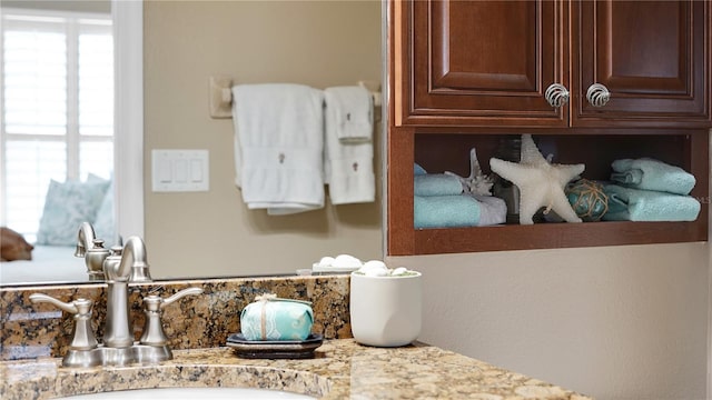 bathroom featuring plenty of natural light and vanity