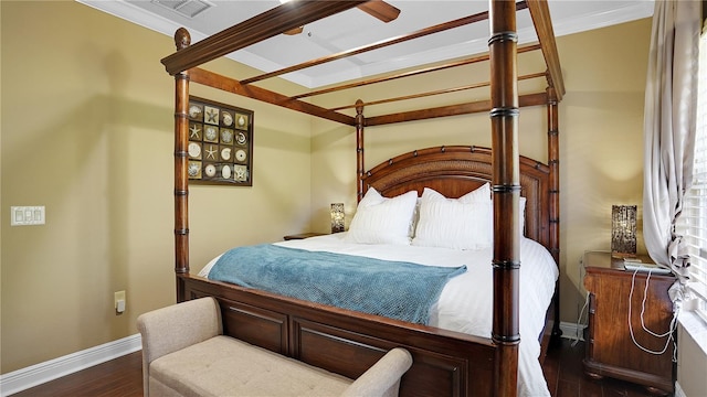 bedroom featuring dark hardwood / wood-style floors and ornamental molding