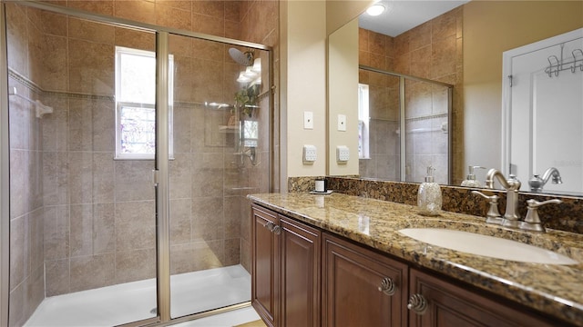 bathroom with vanity and walk in shower