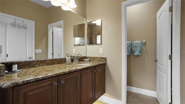 bathroom with vanity and tile patterned floors