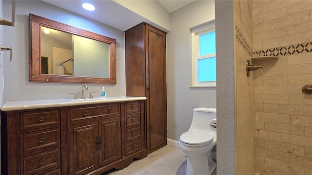 bathroom with vanity, a shower with shower curtain, and toilet