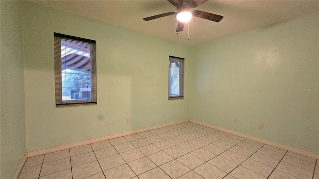 tiled empty room with ceiling fan