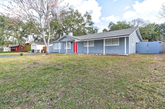 ranch-style home featuring a front yard