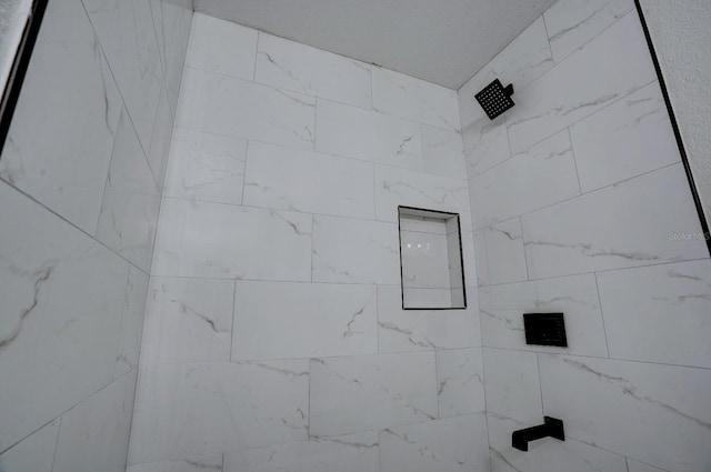 details with a tile shower