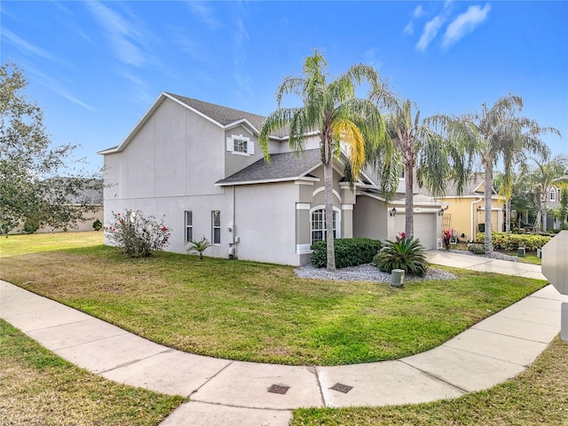 view of side of property featuring driveway, a shingled roof, stucco siding, a garage, and a lawn