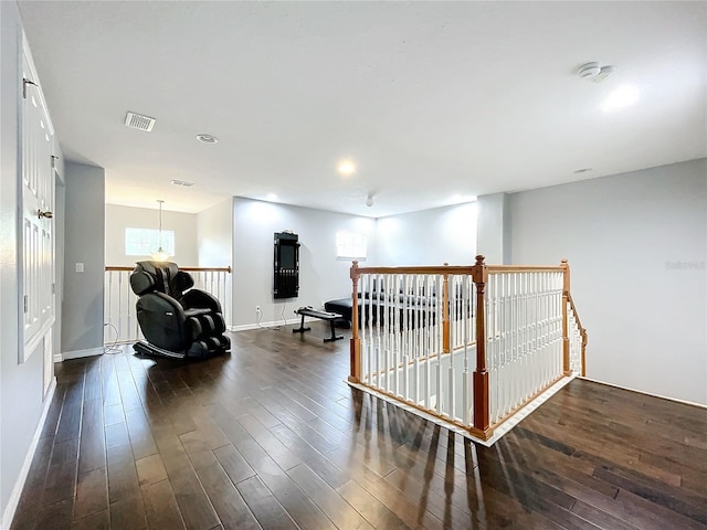 hallway with dark wood-type flooring