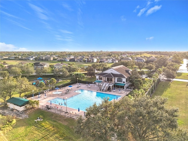 view of swimming pool with a yard and a patio