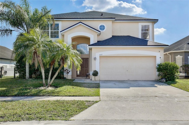 view of front facade with a garage and a front yard