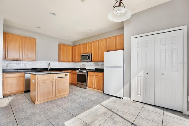 kitchen with tasteful backsplash, stainless steel appliances, decorative light fixtures, and light tile patterned floors