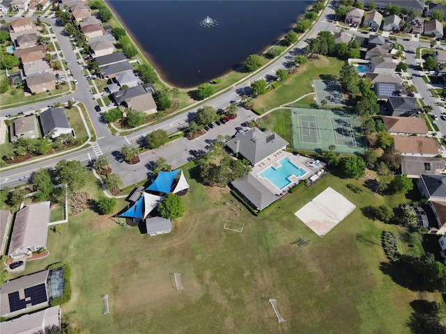 birds eye view of property with a water view