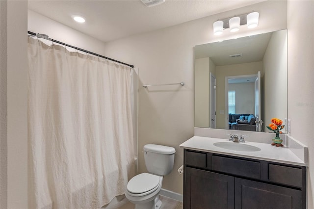 bathroom with vanity and toilet