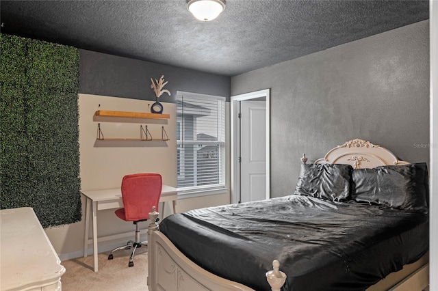 carpeted bedroom featuring a textured ceiling