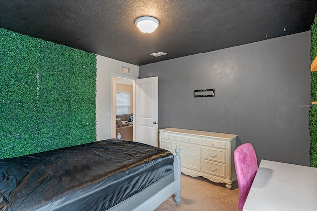 carpeted bedroom with a textured ceiling